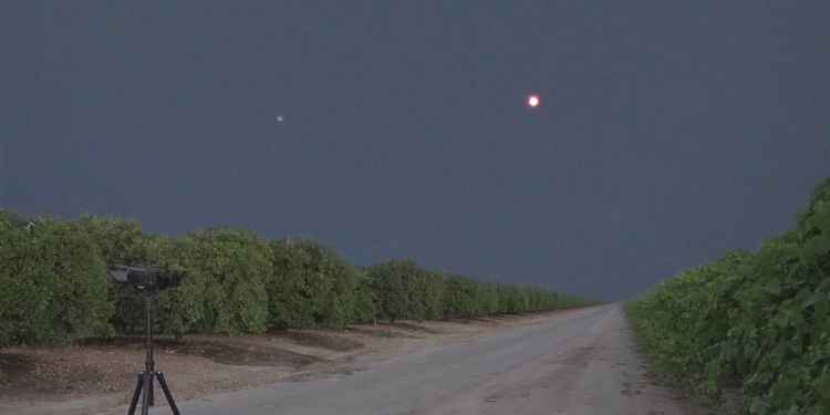 Light emitting object over farm