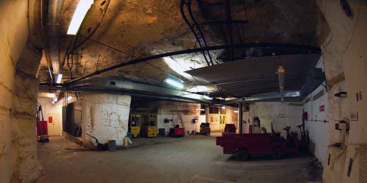 The vehicle depot where several electric buggies can be seen being charged.